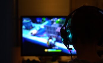 A group of teenagers and adults enjoying video games in a modern gaming lounge in Lahore.